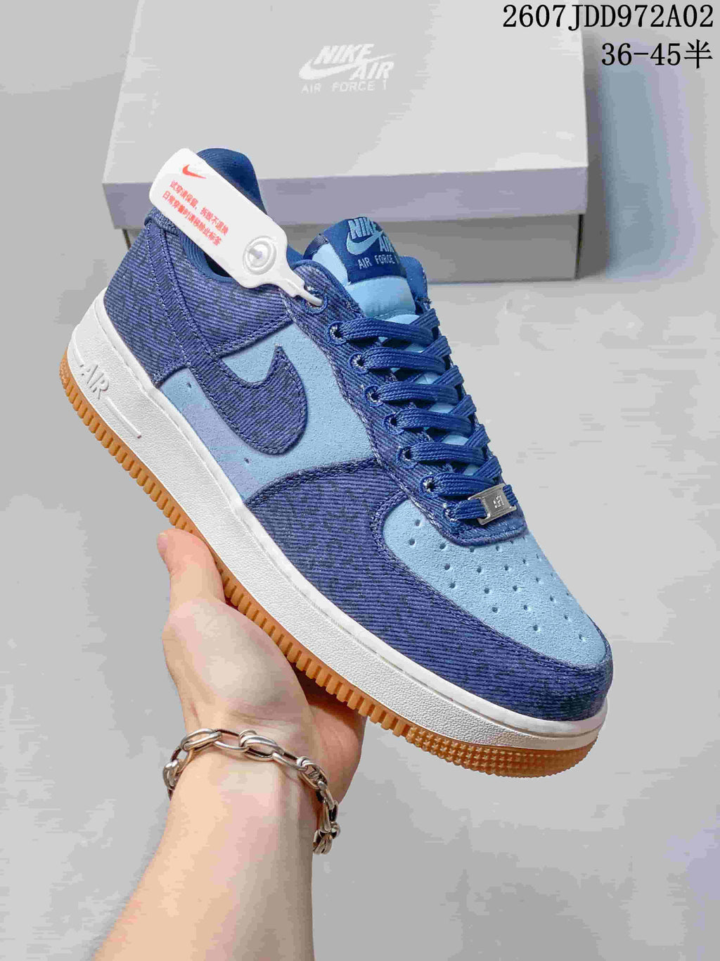 Close side view of the blue Nike Air Force 1 sneaker