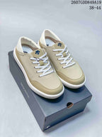 Pair of beige Descente low-top sneakers displayed on a shoebox, with style code 2607GDD849A19 and size range 38–44 visible.