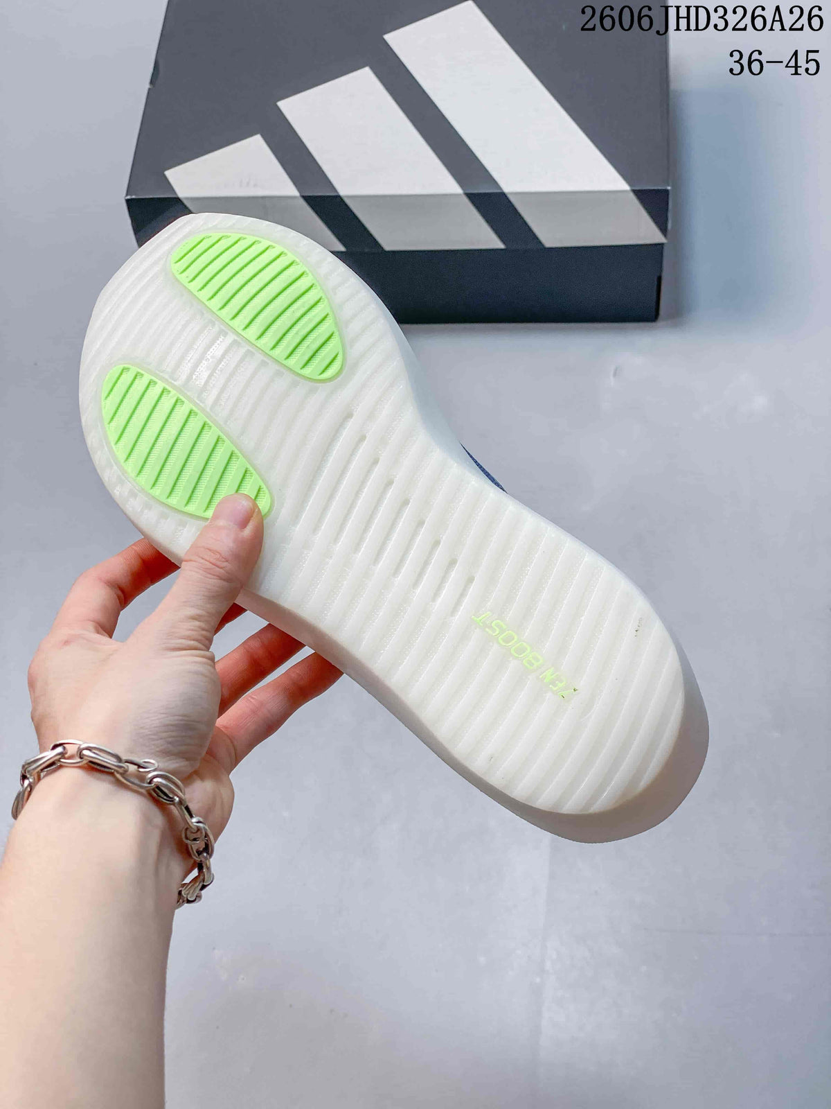 Underside of the shoe showing a white outsole with lime-colored tread sections