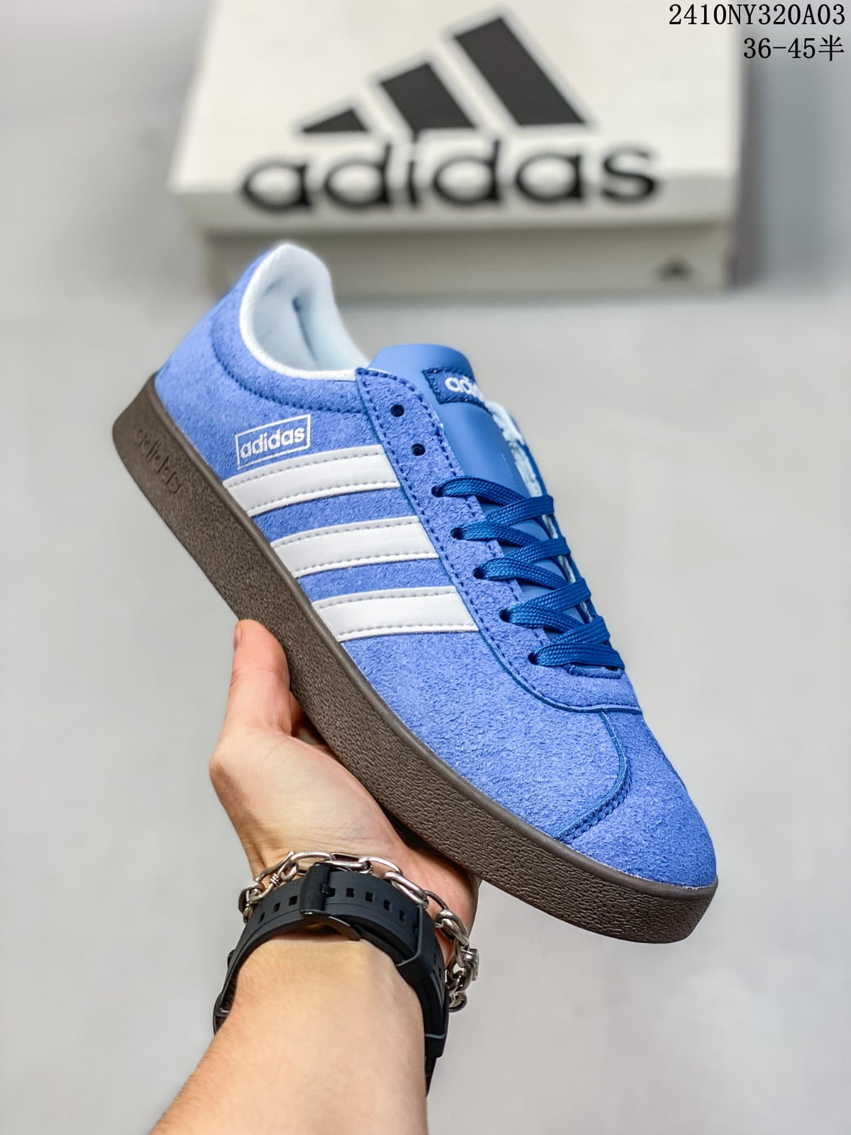 Angled side view showing the Adidas side branding, white stripes and textured brown outsole.