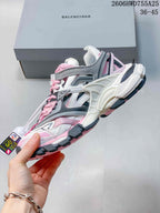 Side view highlighting the layered overlays and chunky sole of a Balenciaga Track 2 sneaker; an image overlay shows a 36–45 size range.