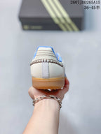 Rear view showing the padded blue collar, heel stitching, and gum-colored sole.