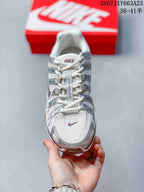 Top view of the sneaker showing the mesh toe box, laces, and layered side overlays.