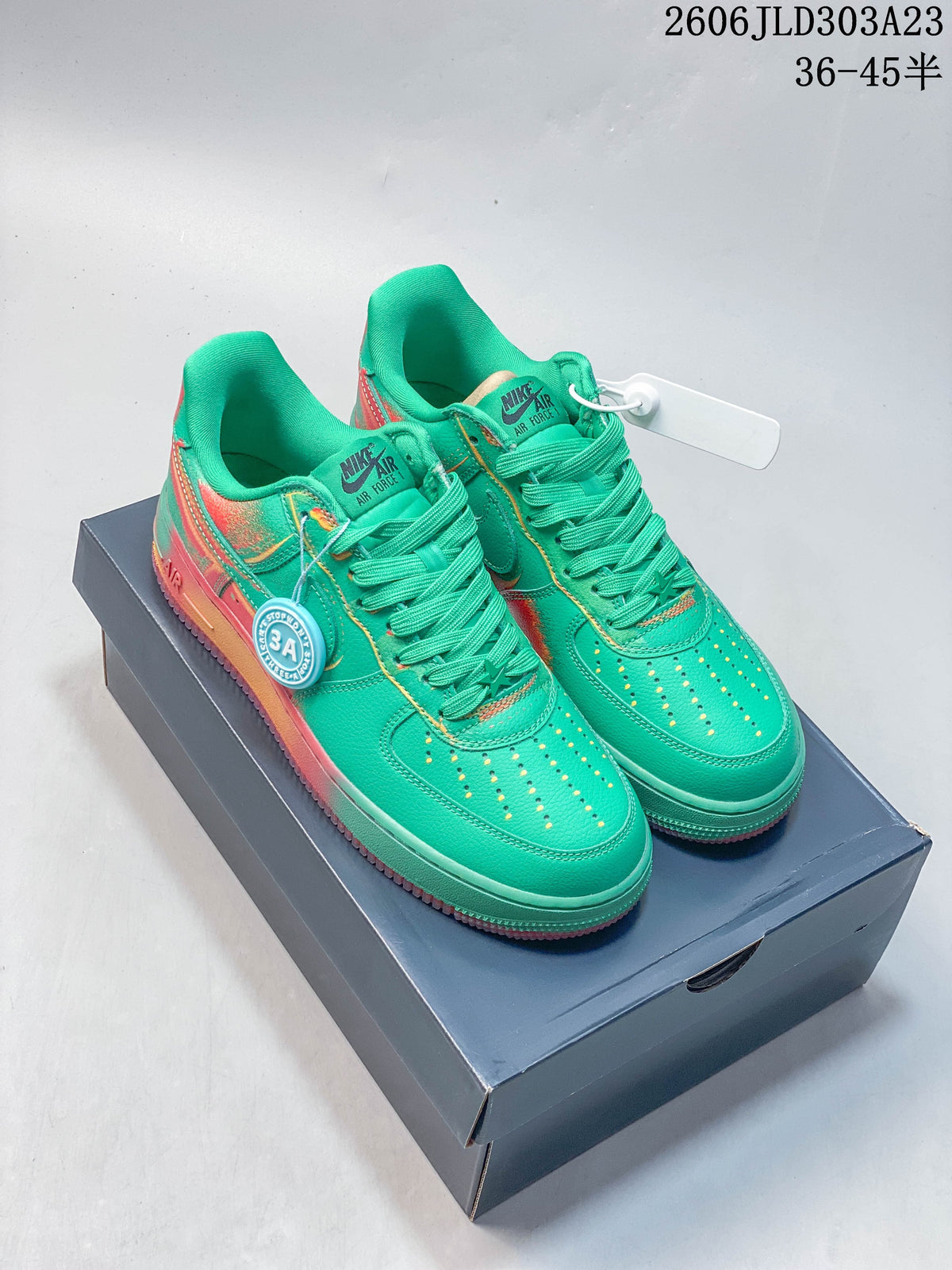 Pair of turquoise-green Nike Air Force 1 '07 low-top sneakers with coral and orange accents, shown on a shoe box