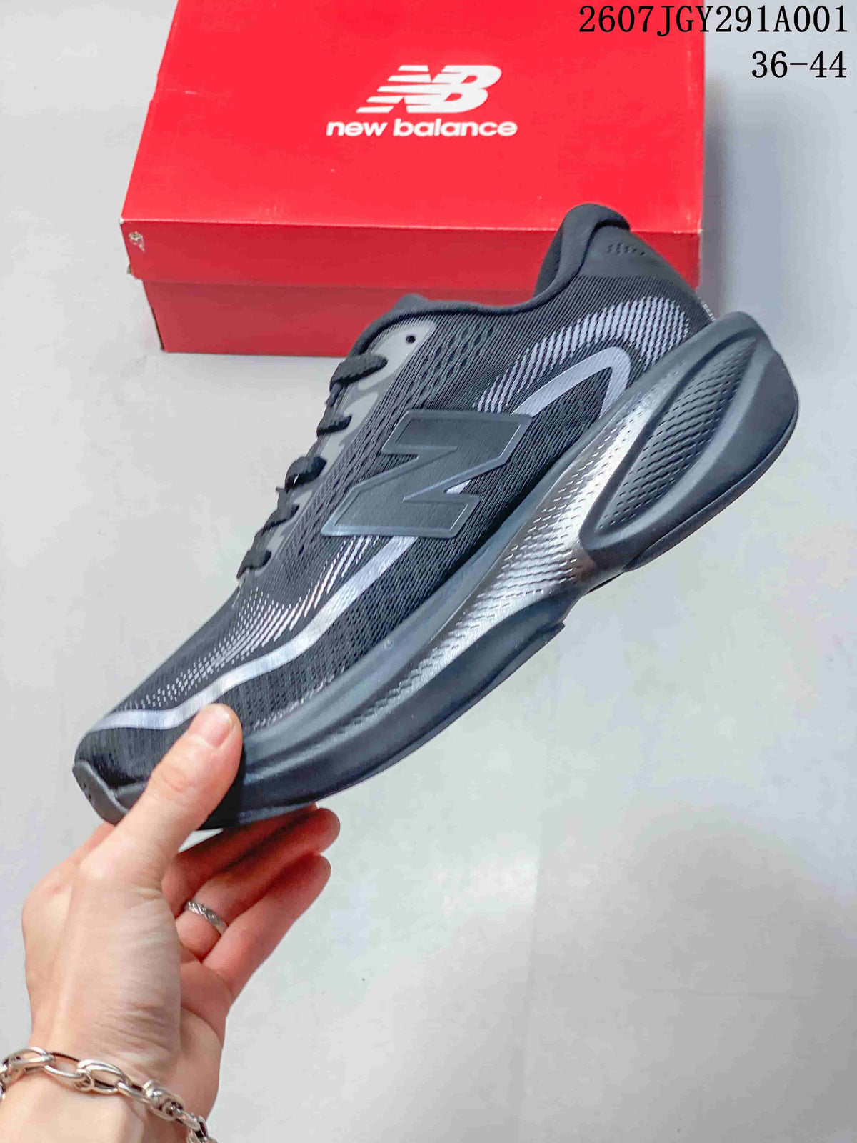 Side view of the dark gray running shoe with a large N logo and patterned upper.