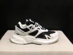 Single side profile of the white and black AMIRI MA Runner sneaker with visible branding.