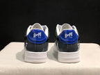 Rear view of the blue and gray Bape Sta sneakers showing blue heel panels, white collars, and branded heel tabs.