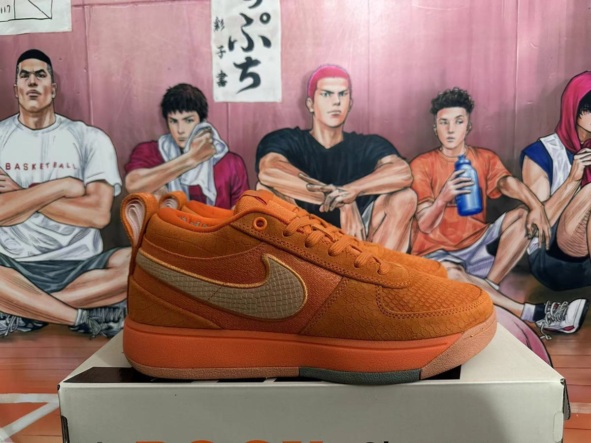 Side view of an orange Nike low-top sneaker with a tan Swoosh