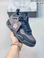 Angled front-side view showing the charcoal and black upper, lace system, side panel, and hangtag.