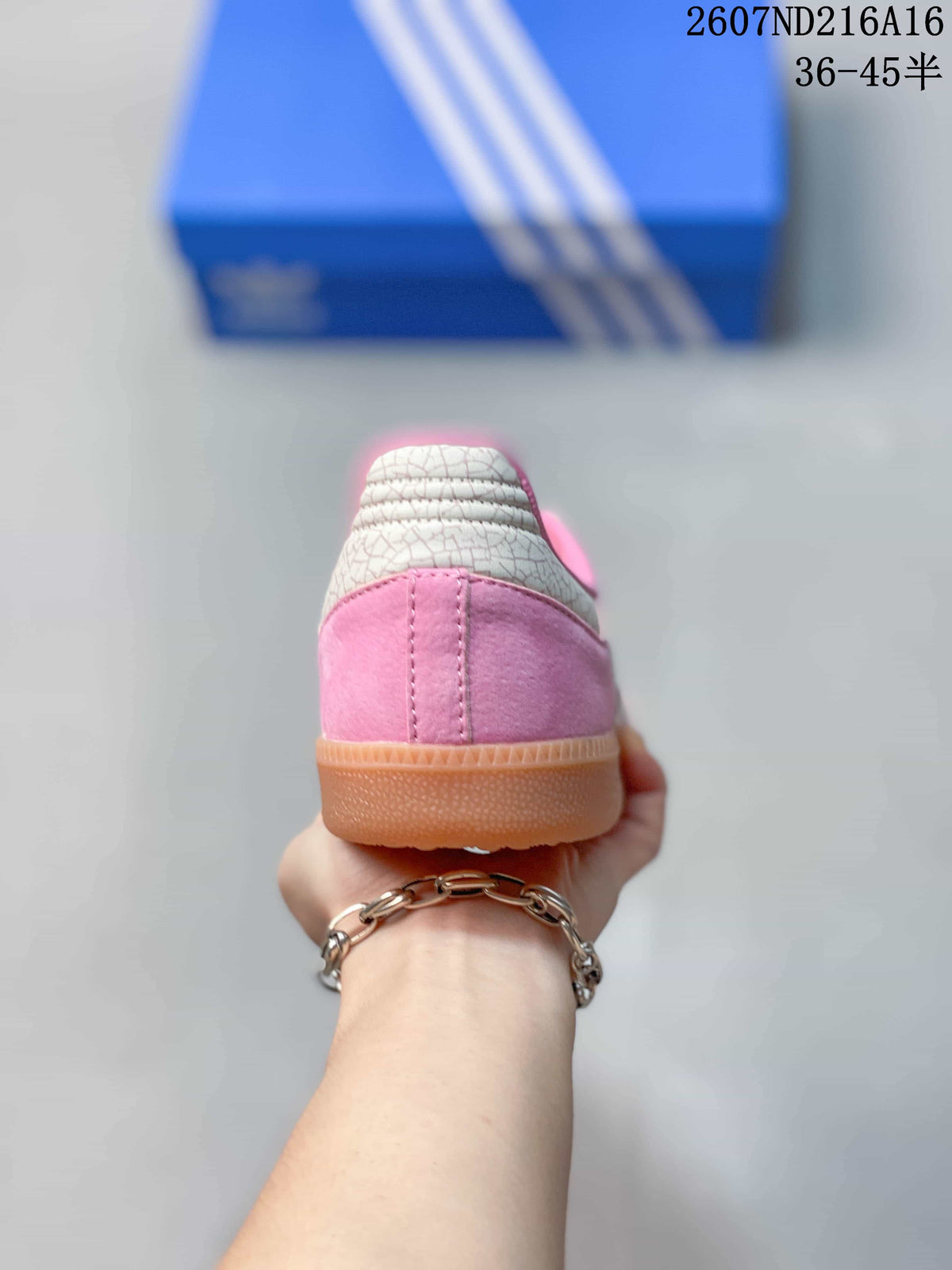 Rear view of the pink sneaker showing the white textured heel panel and gum-colored sole.