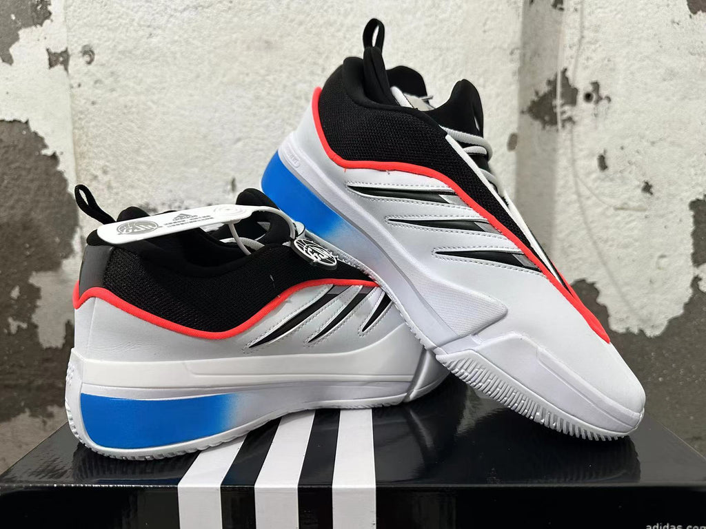 Pair of white, blue, and black basketball shoes shown from the side