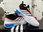 Pair of white, blue, and black basketball shoes shown from the side