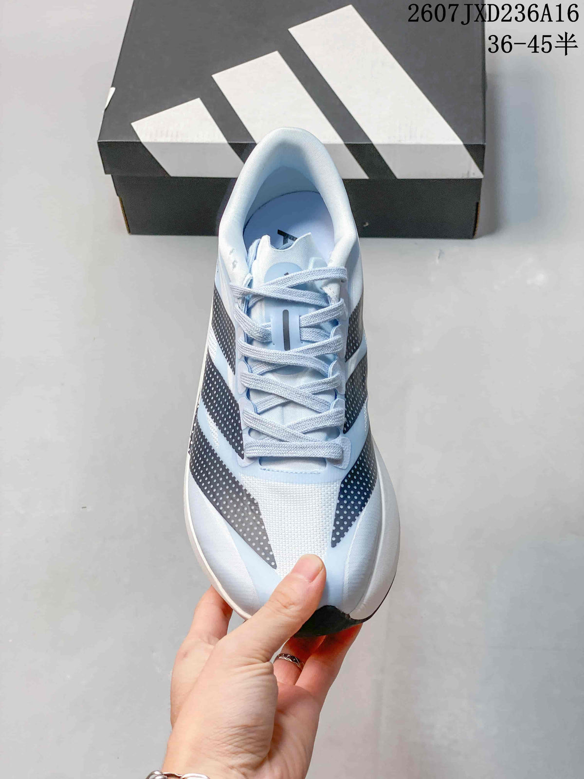 Top view of the lace-up running shoe showing the light blue upper, padded collar and patterned side stripes.