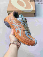 ASICS GEL-SD Lyte sneaker in orange, pale blue and gray, shown with a shoebox.