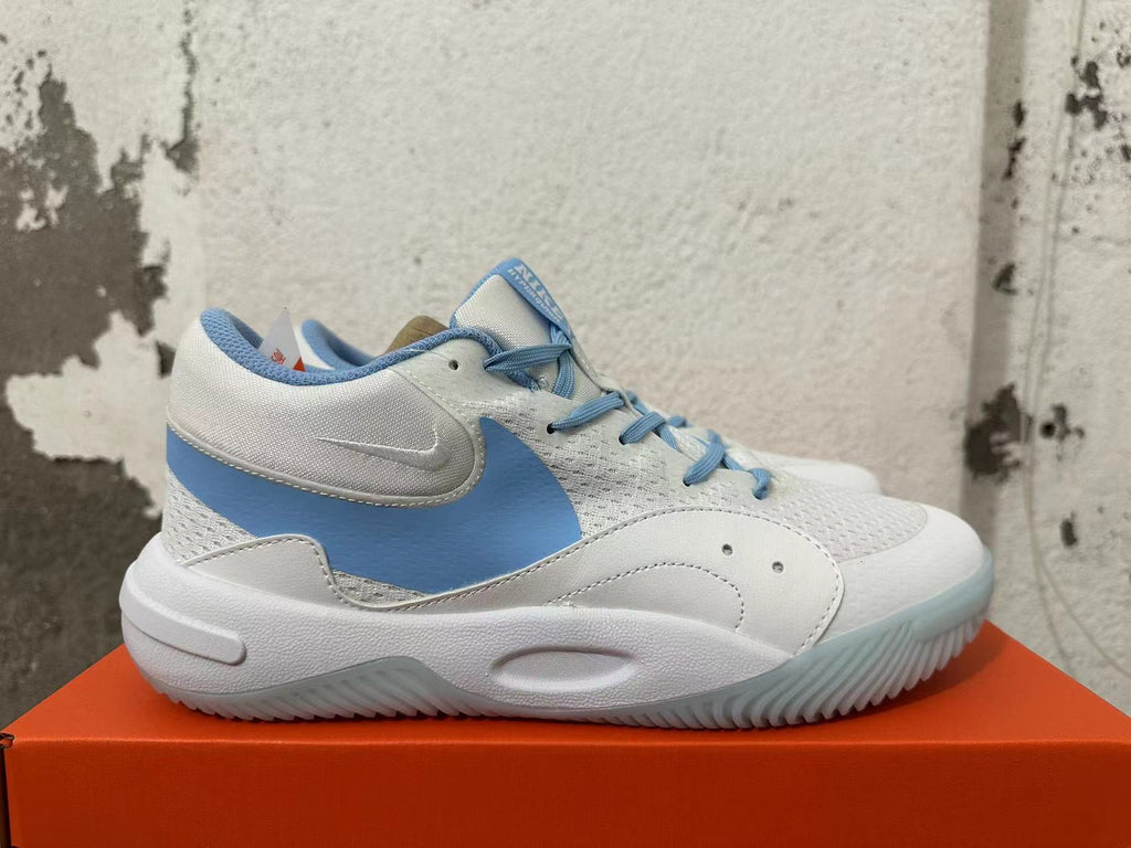 Side view of a white Nike basketball shoe with a sky-blue accent