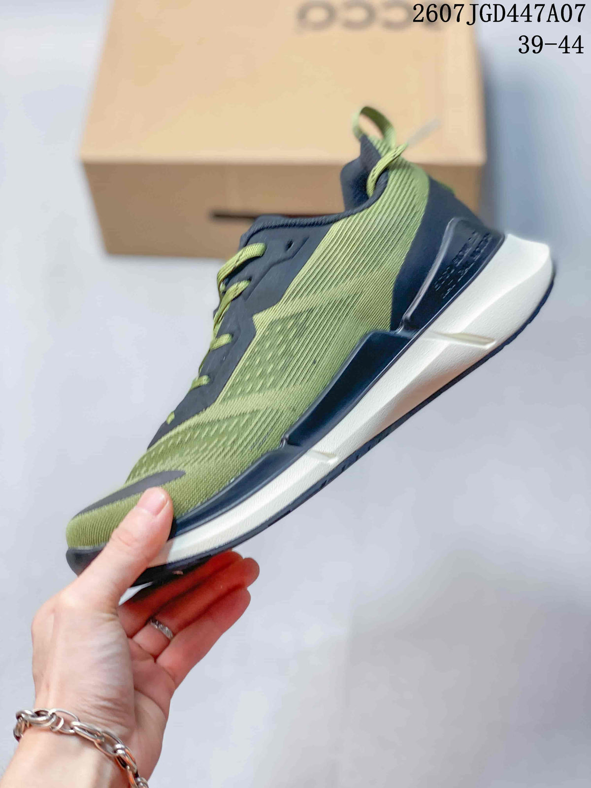 Side profile of the green and navy colorblock sneaker with a white midsole and dark outsole.