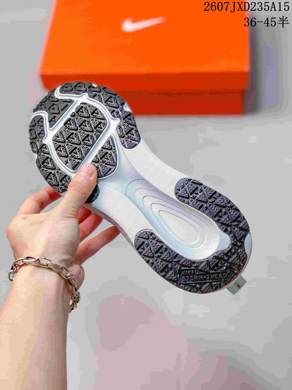 Underside view showing the textured rubber outsole and patterned traction sections.