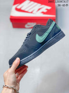 Side profile showing the green Swoosh, black upper, and low-profile rubber sole.