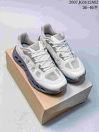 Pair of white and gray On Cloudtilt Remix sneakers displayed on a box