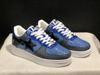 Three-quarter view of the pair highlighting the blue and gray panels, black star details, and white midsoles.