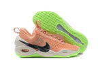 Peach Nike Anthony basketball shoes with cream panels and neon green soles.