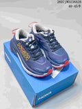 Pair of navy and red HOKA Mafate X Hike 5 trail shoes displayed on a blue shoe box.