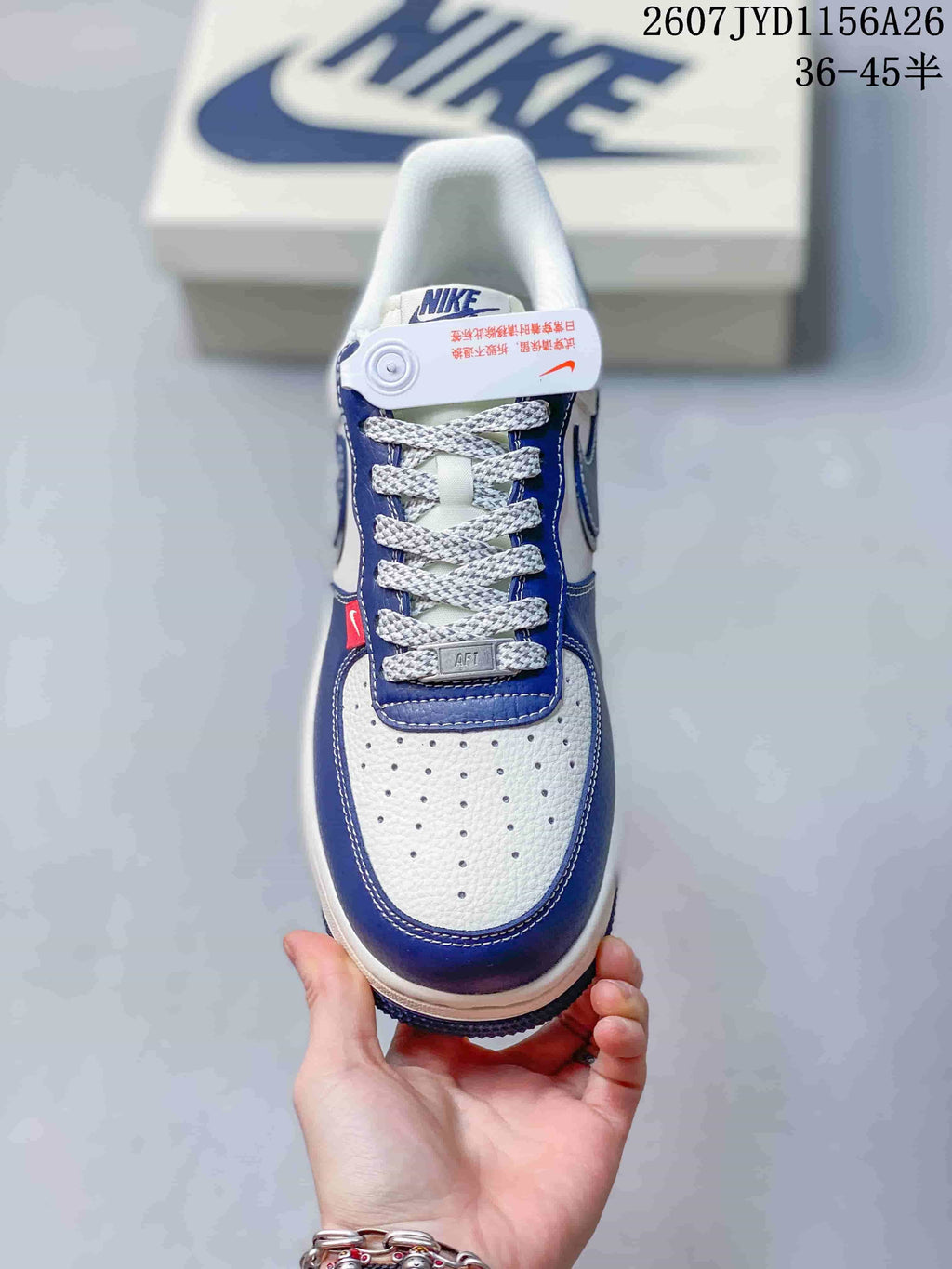 Top view showing the perforated white toe box, blue overlays and woven laces.