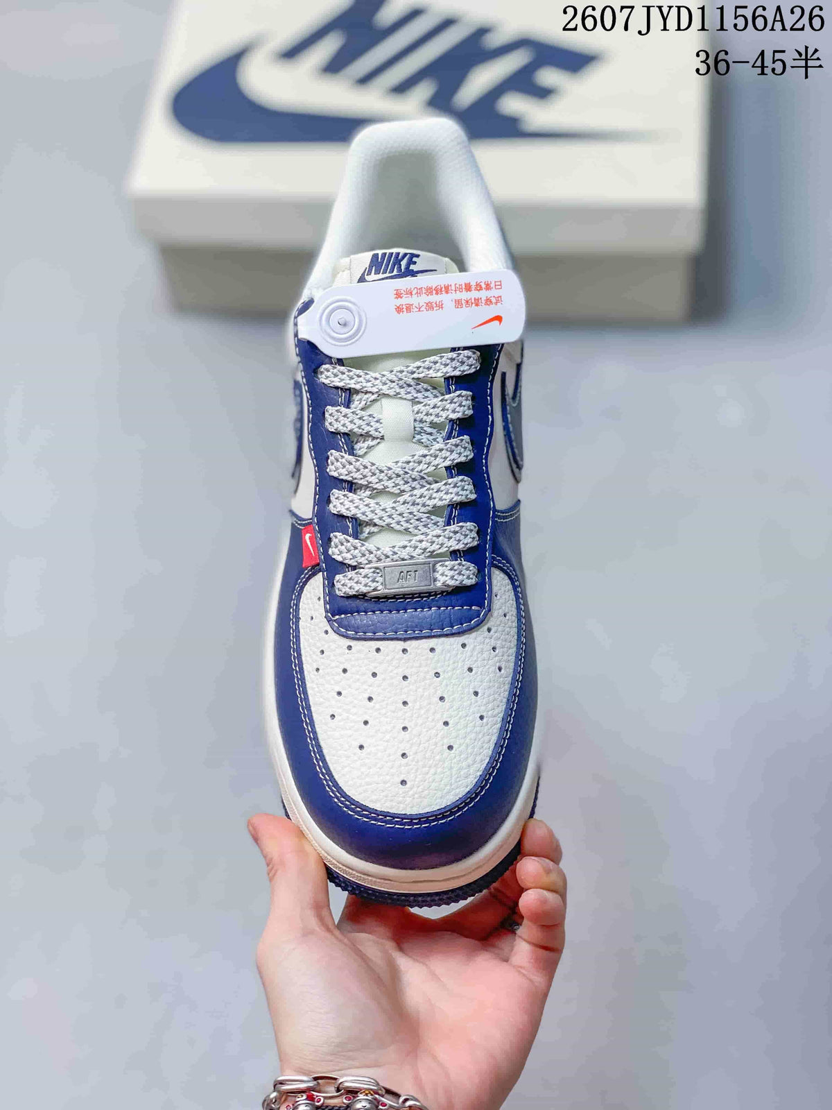 Top view showing the perforated white toe box, blue overlays and woven laces.