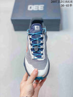 Top view showing the blue laces, lace-pocket detail, gray upper, and white toe area.