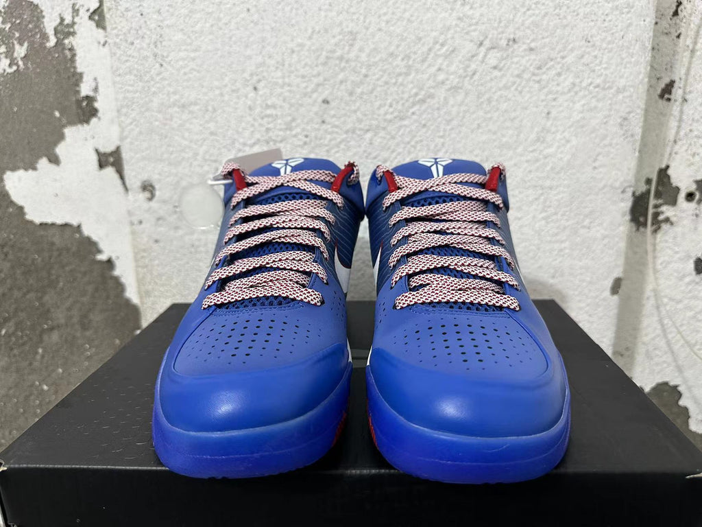 Front view of blue Nike Kobe basketball shoes with patterned laces and perforated toe panels.