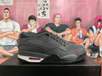 Side profile of a black Nike basketball sneaker with a visible cushioning window and small red accent.