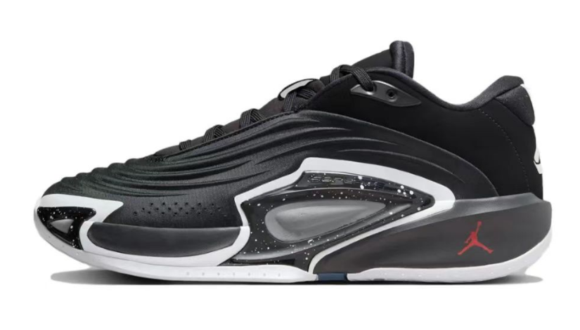 Black shoe with white and gray side accents and a red logo