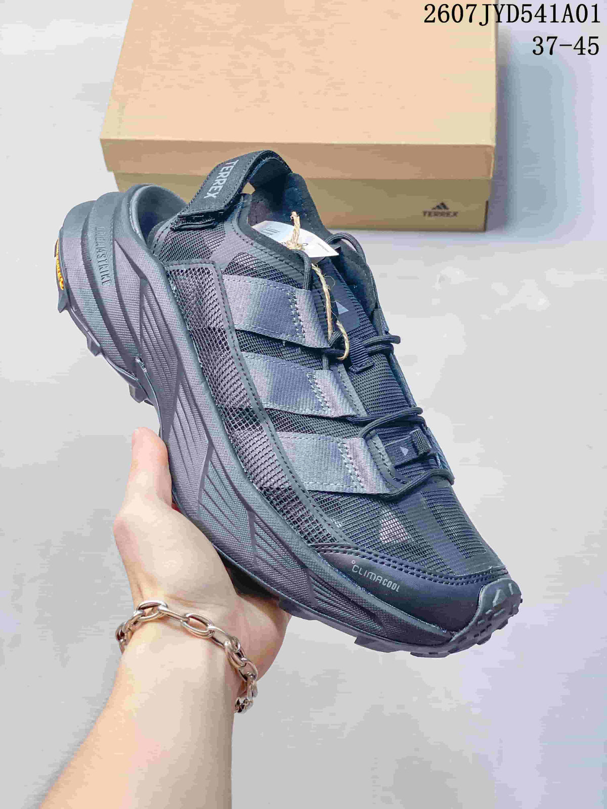 Angled side view of a dark gray Terrex outdoor shoe