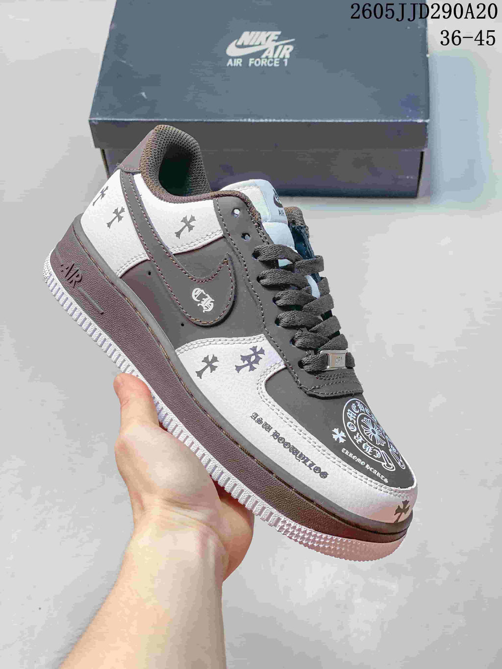 Gray and white low-top sneaker with decorative patterned panels