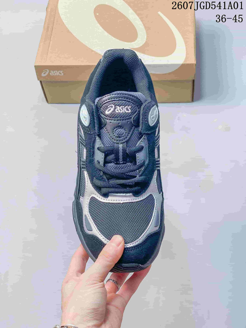 Top view of the sneaker showing the laces and mesh-like toe panel