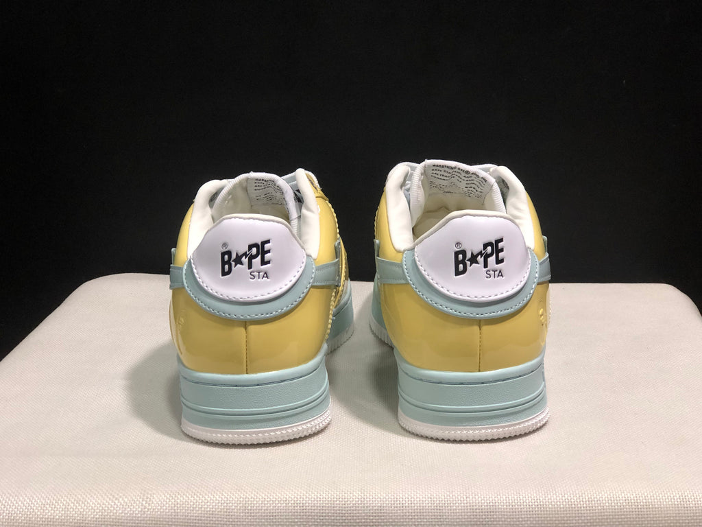 Rear view of the BAPE STA sneakers showing the padded collars, heel branding, and layered light blue heel details.
