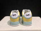 Rear view of the BAPE STA sneakers showing the padded collars, heel branding, and layered light blue heel details.