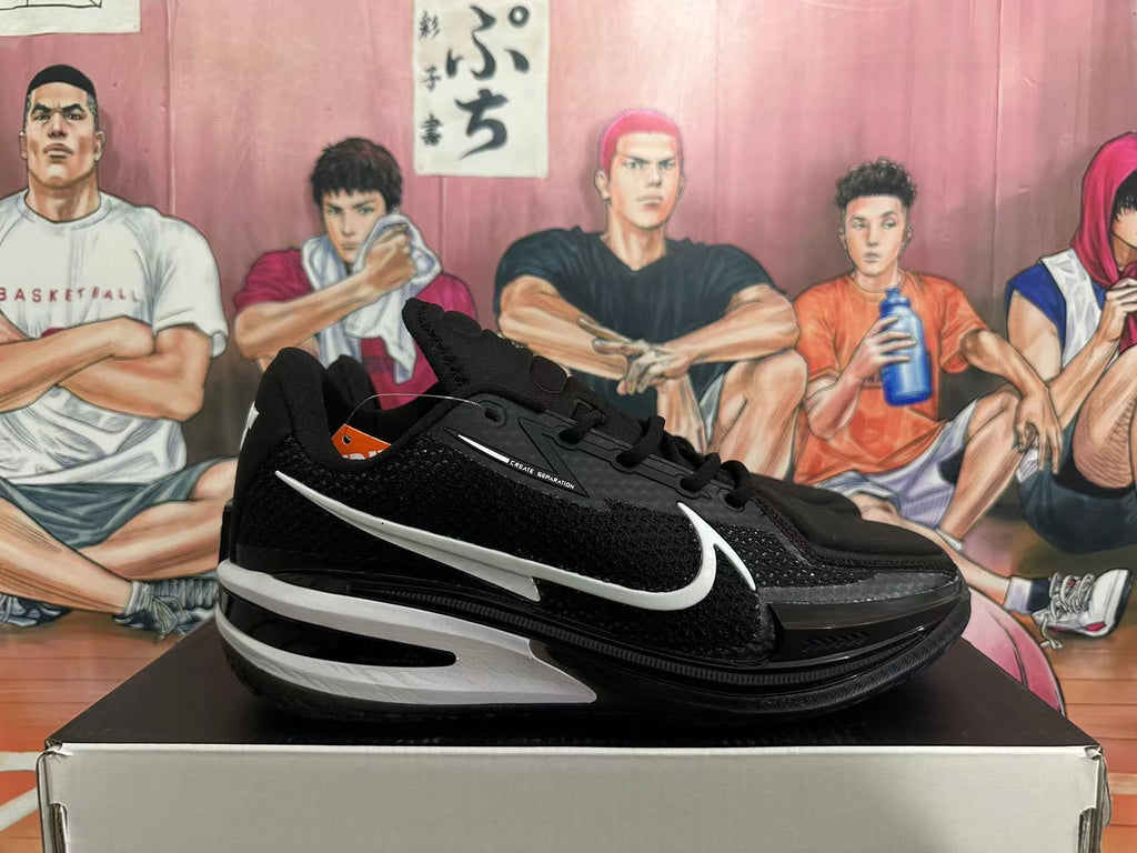 Side view of a black basketball shoe with white accents and a Swoosh-style mark
