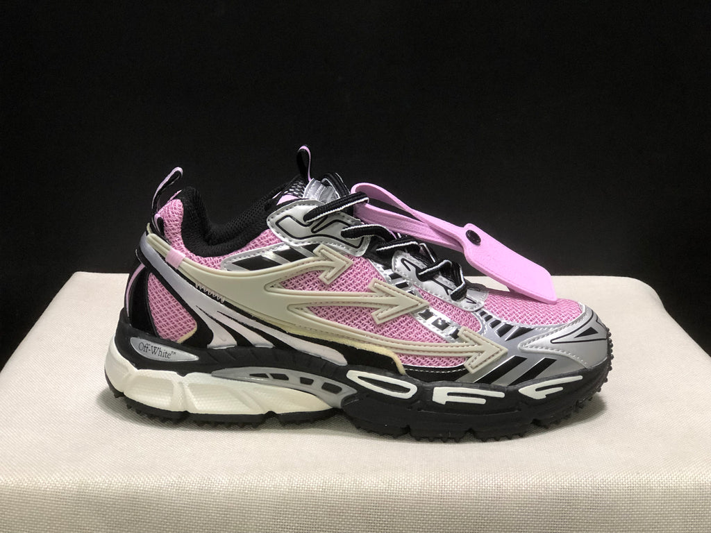 Side profile highlighting the pink upper panels, layered side details, and chunky outsole.