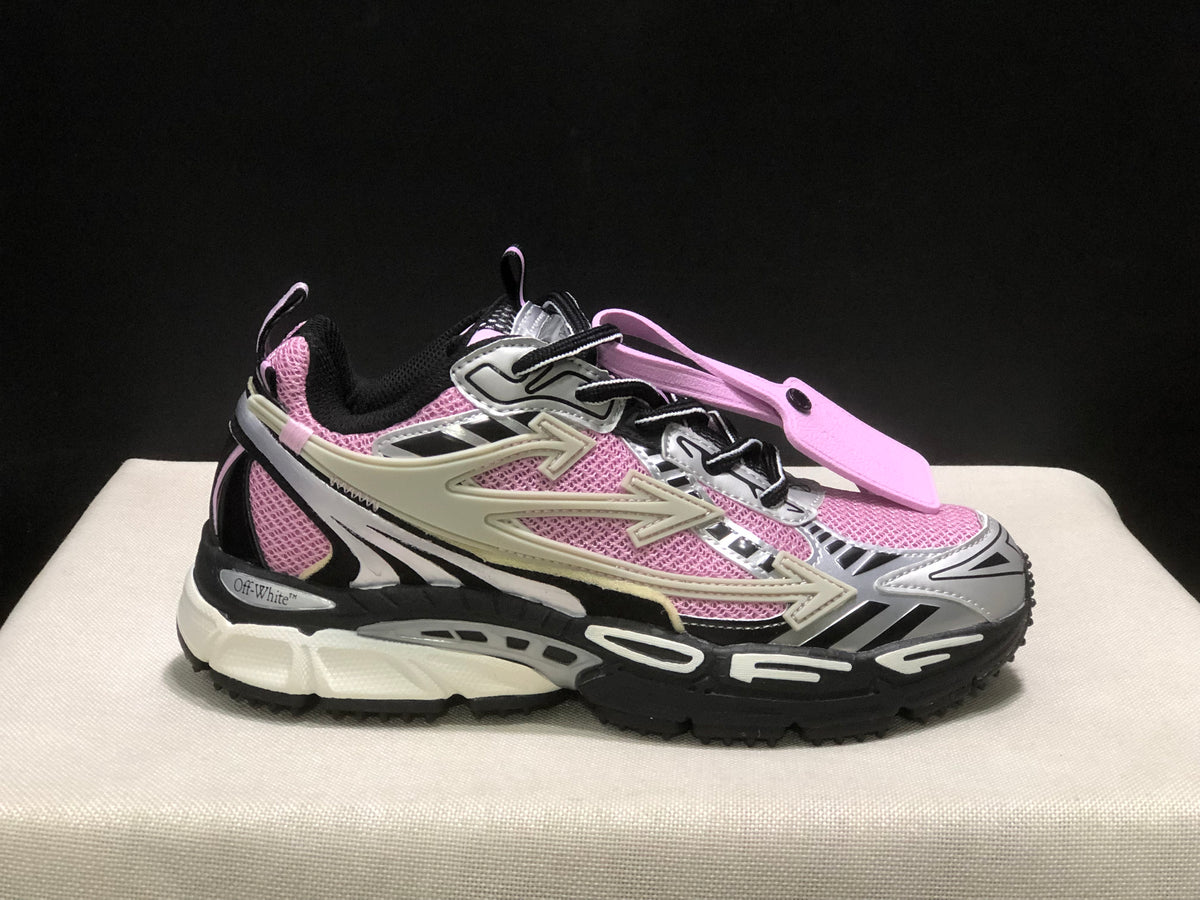 Side profile highlighting the pink upper panels, layered side details, and chunky outsole.