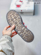 Bottom view of the sneaker showing a patterned translucent outsole with adidas trefoil motifs.