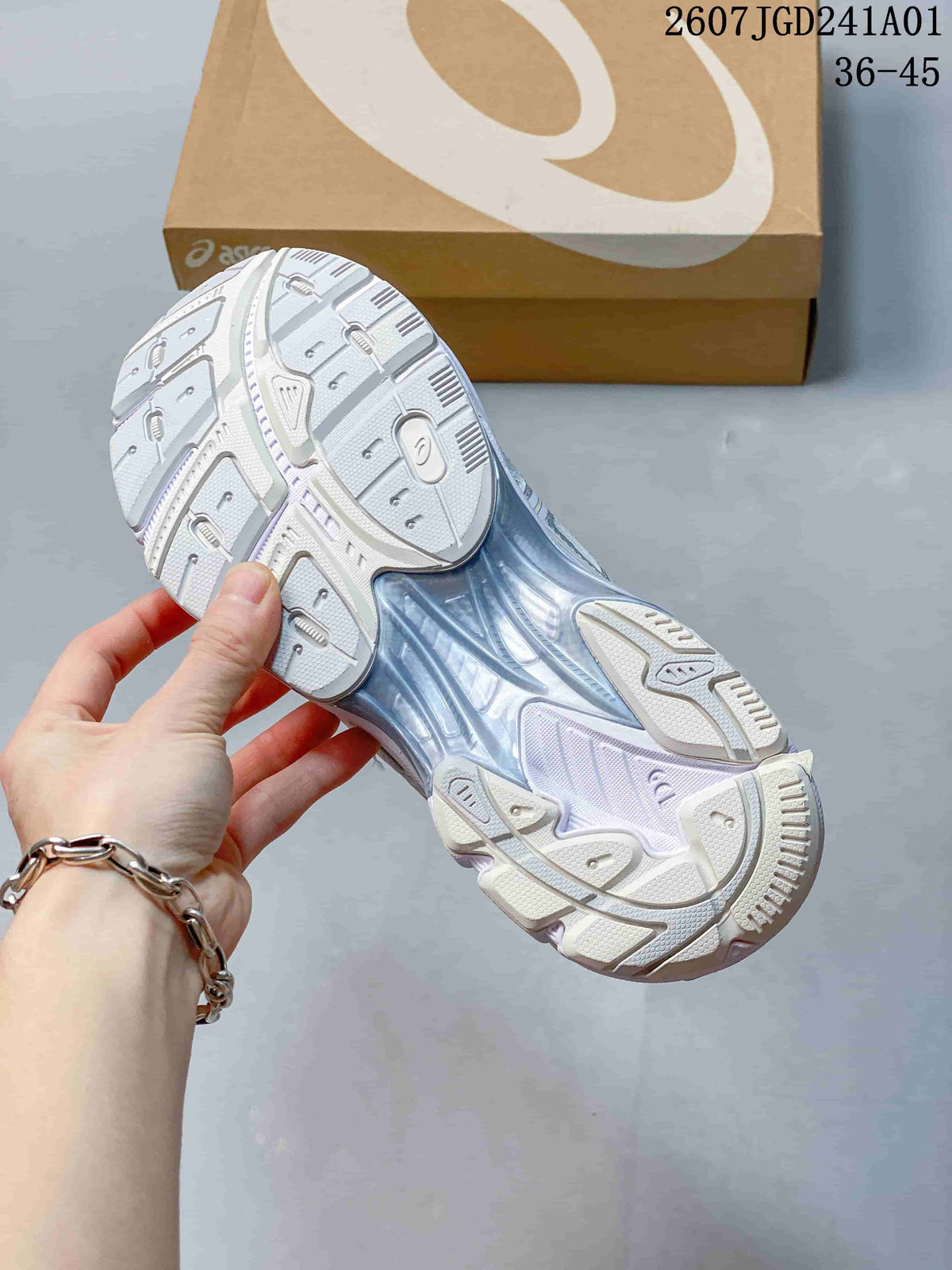 Underside of a white and silver ASICS GT-2160 Breeze sneaker showing the patterned outsole.