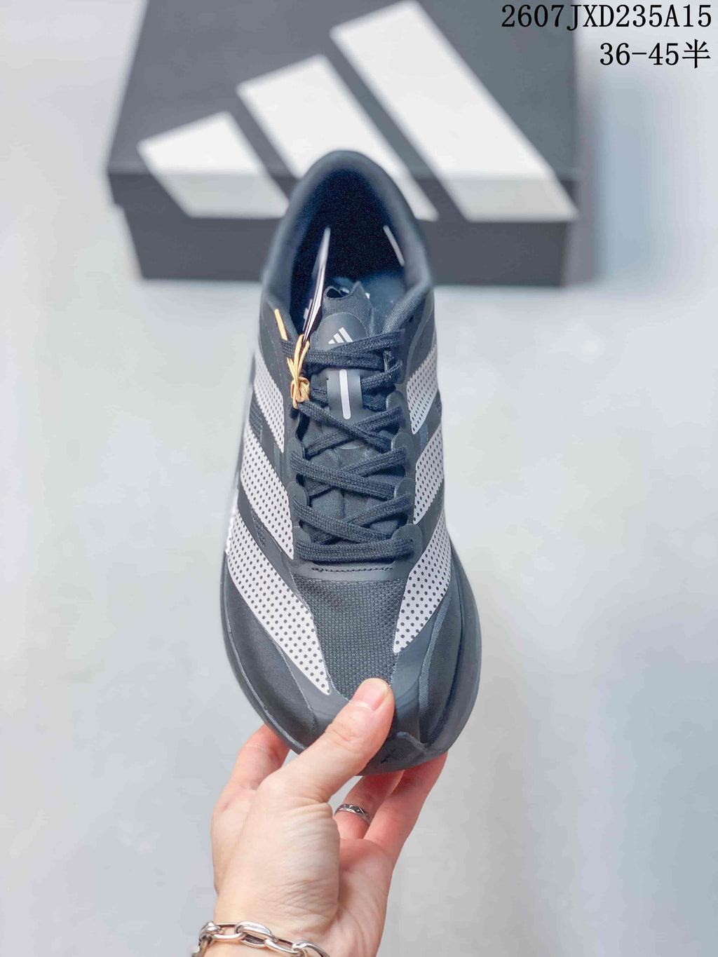Top view showing the laces, padded collar, dark upper, and white side accents.