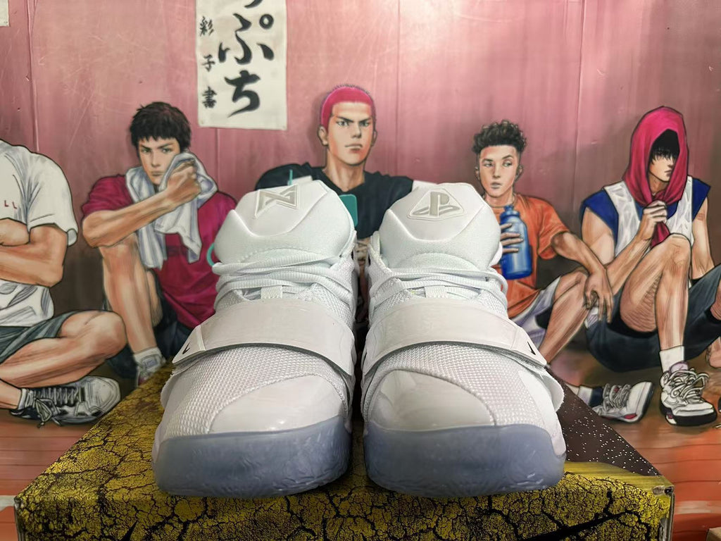 Front view of white Nike PG 6 basketball shoes with wide midfoot straps and translucent-looking toe outsoles.