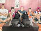 Front view of black and grey Nike sneakers with lace-up fastening and small Swoosh details