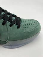 Close-up of the perforated toe panel and mesh beneath the black laces