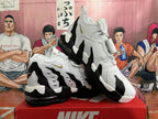 Pair of white and black Nike-branded sneakers shown from the side and at an angle.
