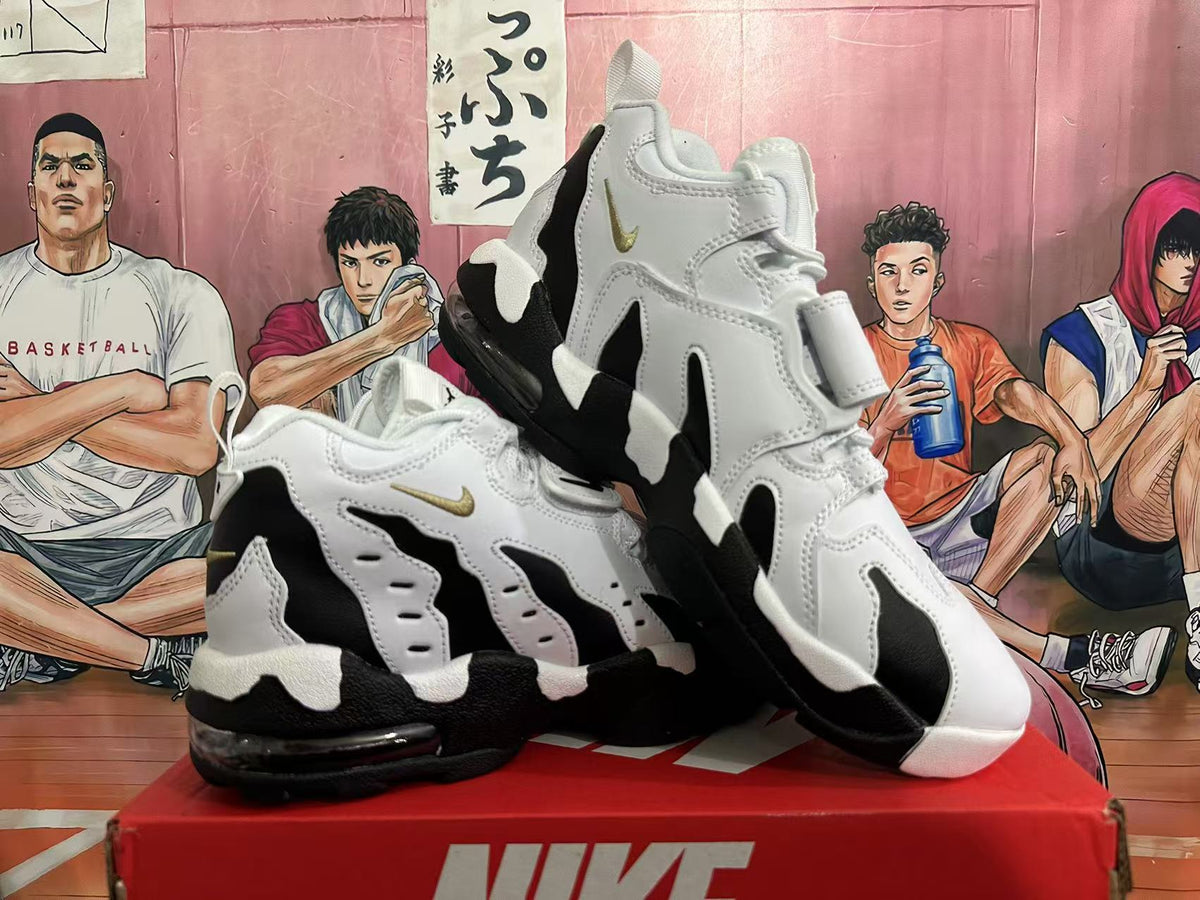 Pair of white and black Nike-branded sneakers shown from the side and at an angle.