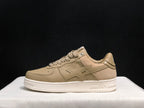 Side profile of a beige BAPE STA sneaker showing the star-shaped side applique and white sole.