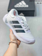 White adidas Dropset 4 training shoe with black side stripes and a translucent outsole section.